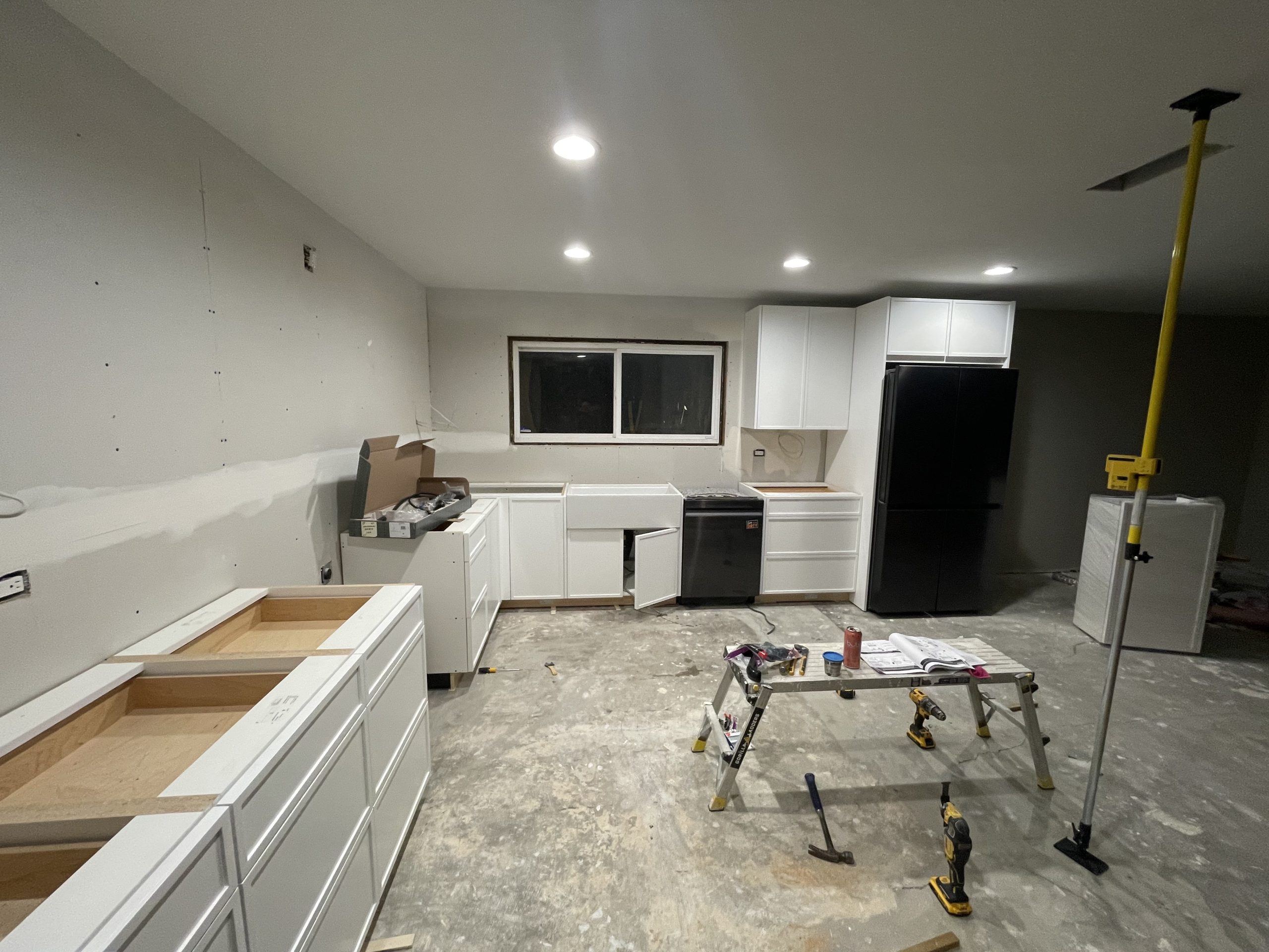 Bathroom vanity with double mirrors and modern light fixtures