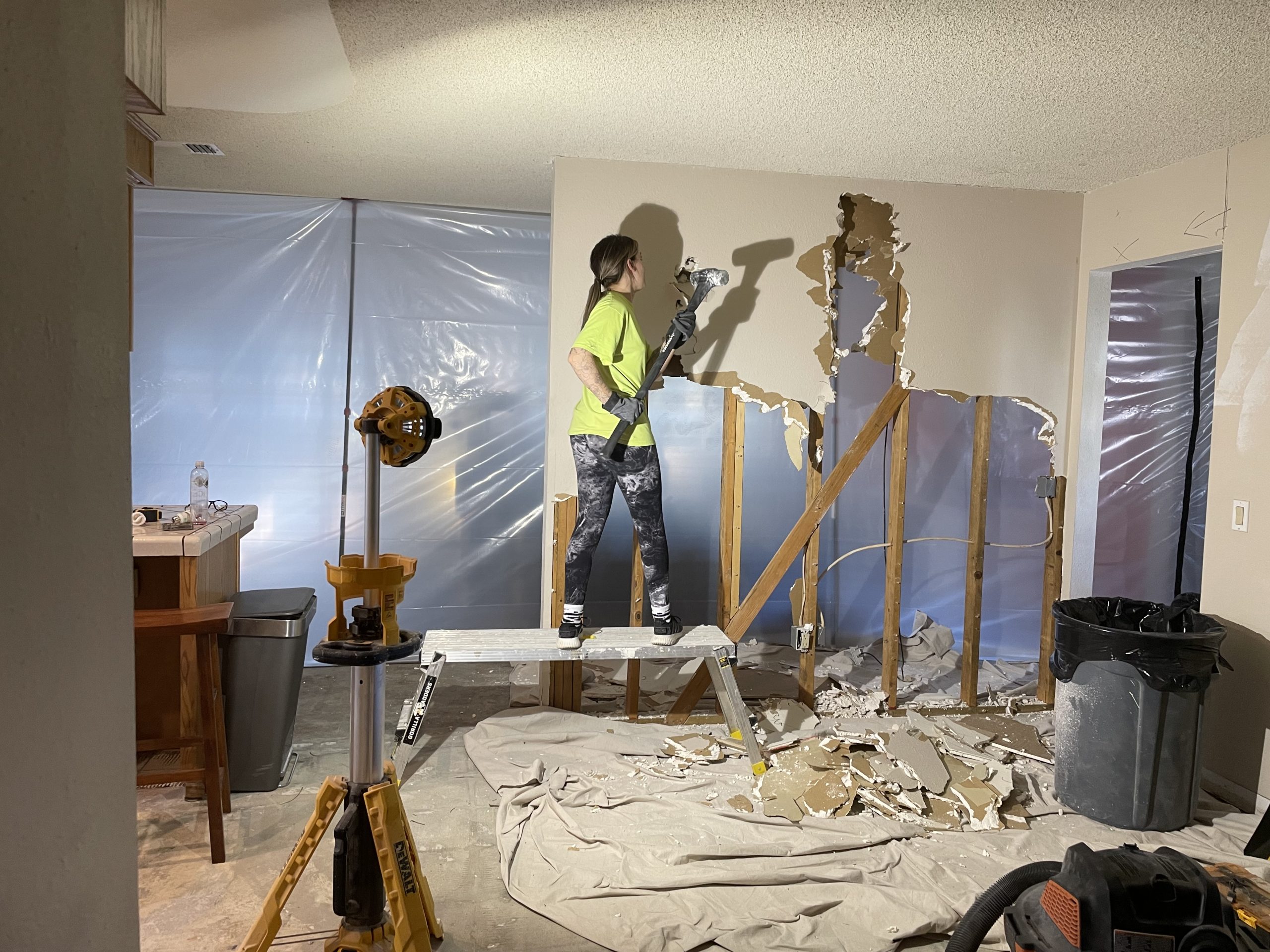 Autumn Pressley wielding a hammer on demolition day