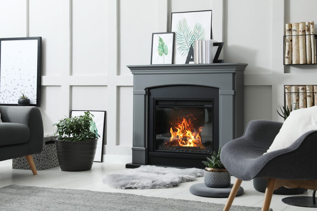 Sleek vented gas fireplace in contemporary living room with ceramic logs and efficient heating