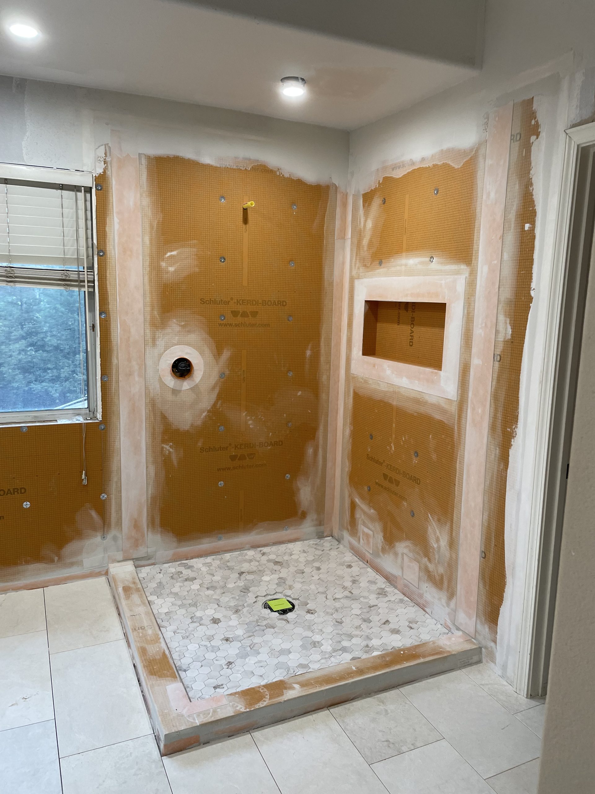 During construction: Shower base installation