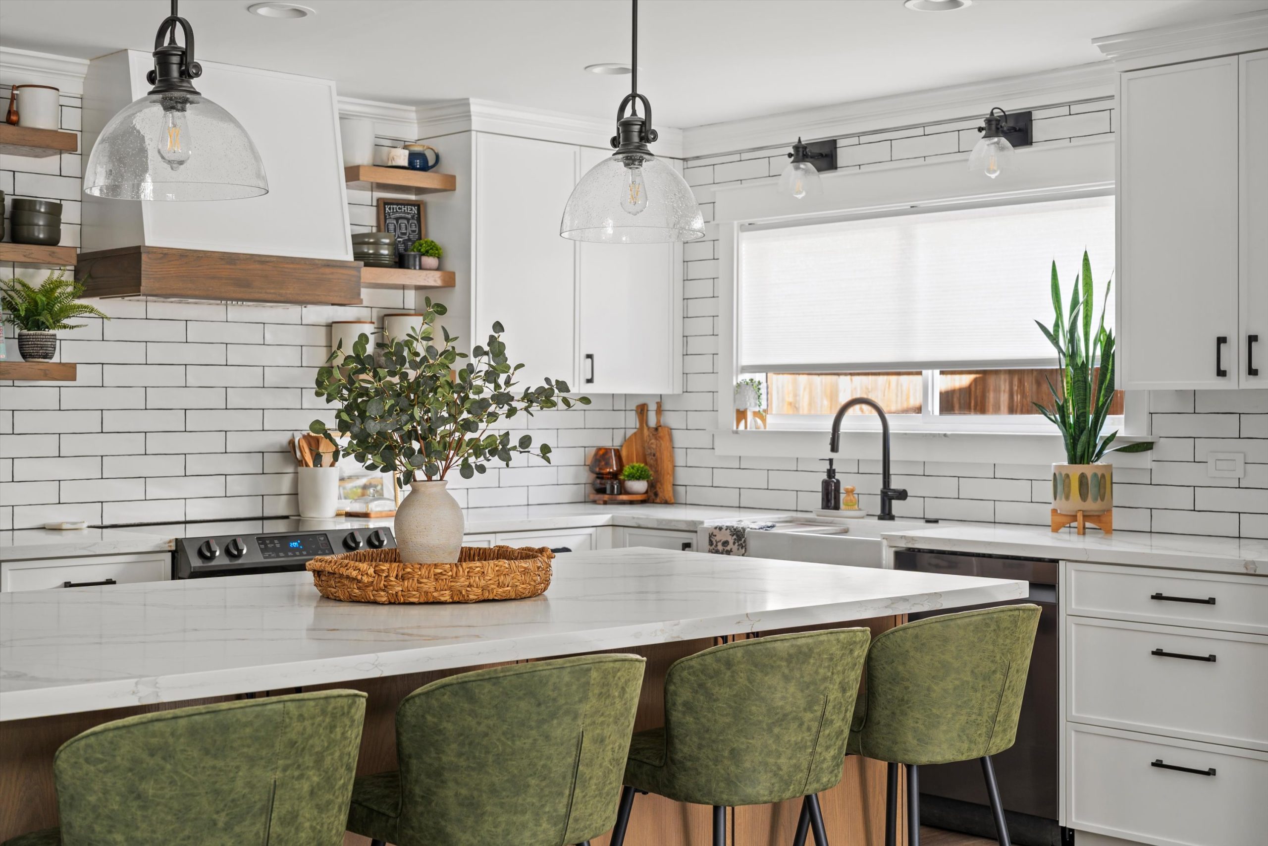 Bright kitchen remodel with white shaker cabinetry, subway tile backsplash, and island with green upholstered stools